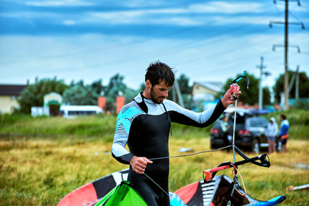 Kite Surfing on waves at sea in summer.の写真素材