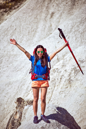 Adventure trekking in the mountains with a backpack and tent.の写真素材
