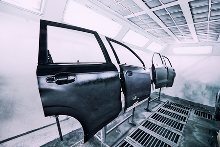 Restoration painting of a black car in the service center.の写真素材