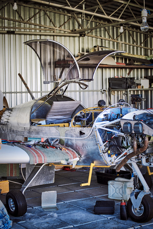 Light  single-engine aircraft for maintenance of the engine in the hangar .の写真素材