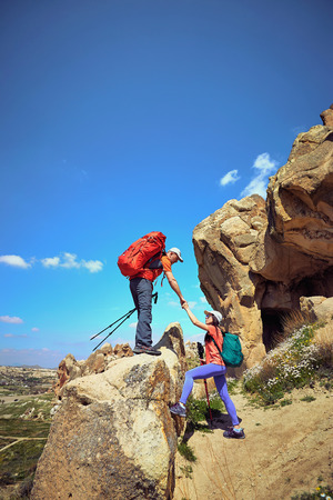 Adventure trekking in the mountains with a backpack and tent.の写真素材