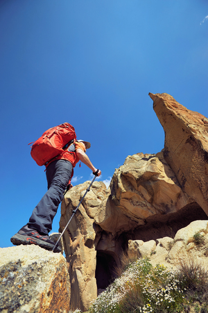 Adventure trekking in the mountains with a backpack and tent.の写真素材