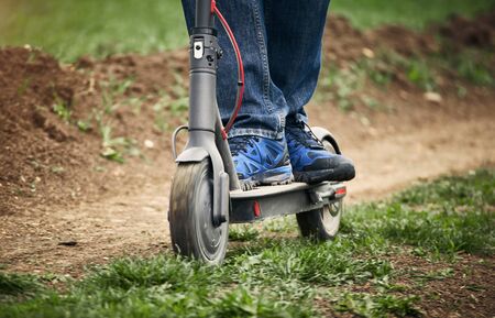Using an electric scooter as a vehicle in rural areas.