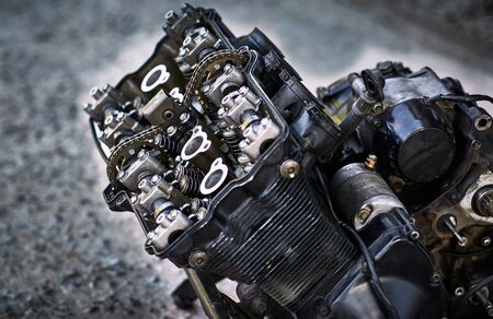 Removing and repairing a motorcycle engine in a service center.の写真素材