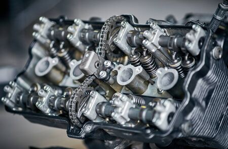 Removing and repairing a motorcycle engine in a service center.の写真素材