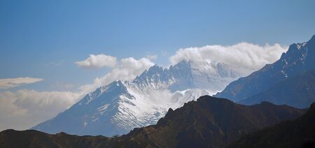 Beautiful landscape in the mountains with snow-capped peaks in the Himalayan mountains.