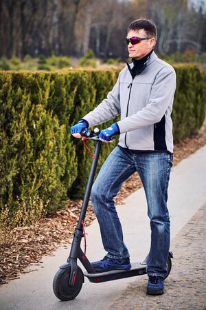 Electric scooter is an economical means of transportation in the city.の写真素材