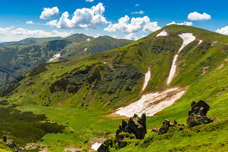 The most beautiful landscape with peaks in the background, sky with clouds on a sunny day.の写真素材