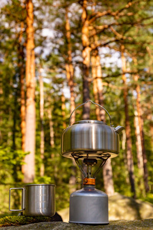 A kettle on the fire during a hike in the mountains.の写真素材