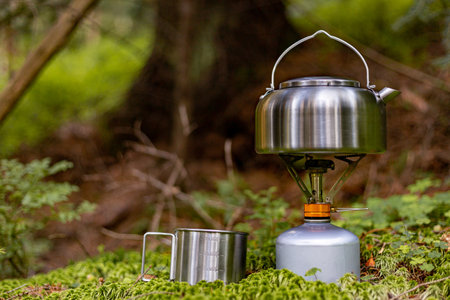 A kettle on the fire during a hike in the mountains.の写真素材
