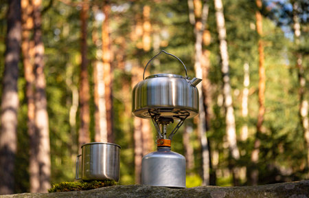 A kettle on the fire during a hike in the mountains.の写真素材