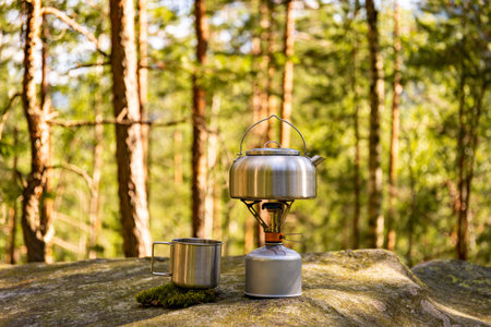 A kettle on the fire during a hike in the mountains.の写真素材