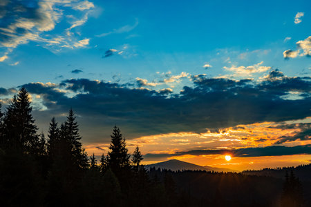 The most beautiful landscape with peaks in the background, sky with clouds at sunset.の写真素材