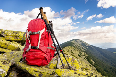Hiking high in the mountains with a backpackの写真素材