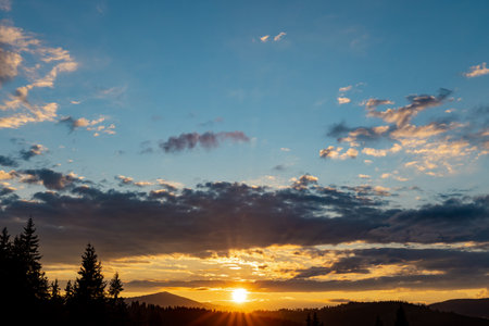 The most beautiful landscape with peaks in the background, sky with clouds at sunset.の写真素材