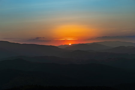 Sunset on the top of the mountain, mountain peaks on the background of the mountain landscape.の写真素材