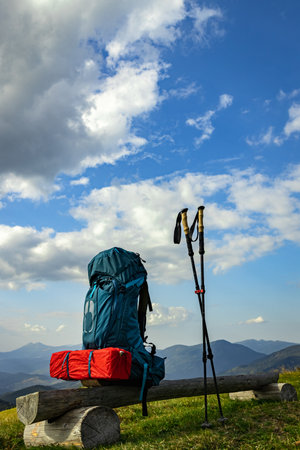 Hiking in the mountains in summer with a backpack and a tent. Beautiful landscape in the mountains.の写真素材
