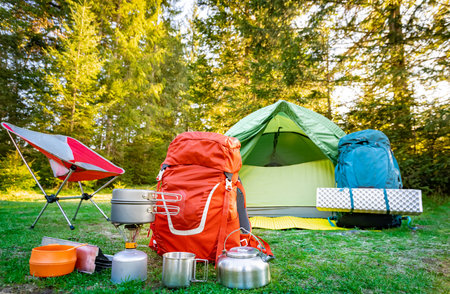 Equipment for camping and hiking in the mountains in summer.の写真素材