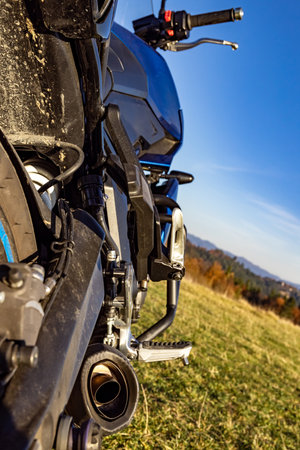 Rear of the motorcycle with wheel and chain drive, side view.の写真素材