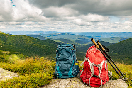Mountain landscape with peaks and backpacking equipment.の写真素材