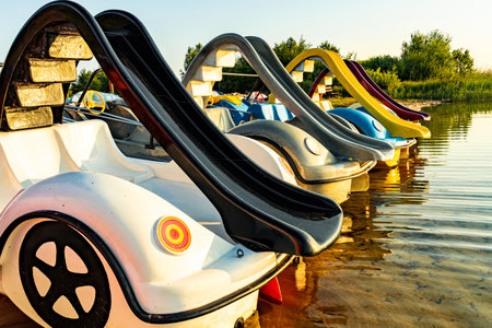 Early morning on the shore of a beautiful lake with attractions for children.の写真素材