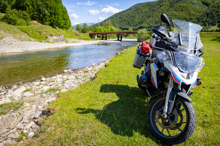 Motorcycle trip in the mountains, beautiful landscape by the mountain river.の写真素材