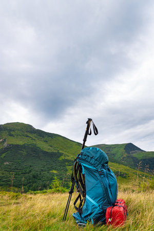 Summer hiking in the mountains with a backpack and a tent. Beautiful mountain landscape.の写真素材