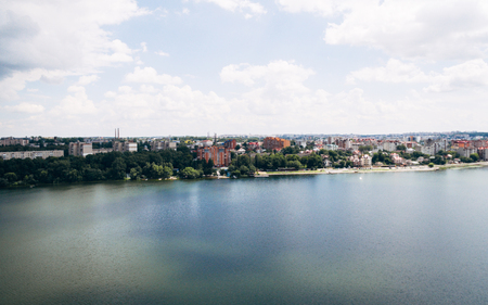 Aerial view of the green picturesque town on the shore of the lake. Ternopil. Ukraineの写真素材
