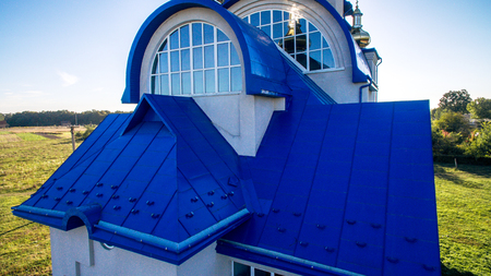 Blue tile and a beautiful arched window on the new churchの写真素材
