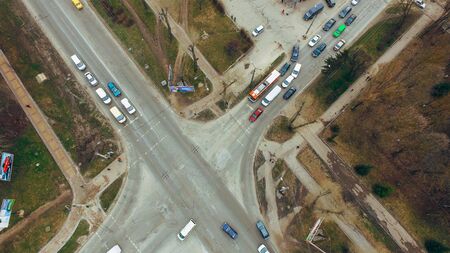 Cars stand at the intersection near the sphetophor. Air view.