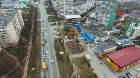 Aerial view of small town street, highway, early spring parkの写真素材