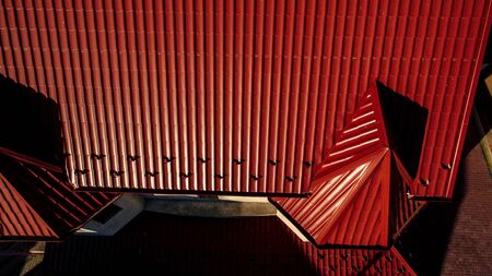 Aerial view of the wide red tiled roof.