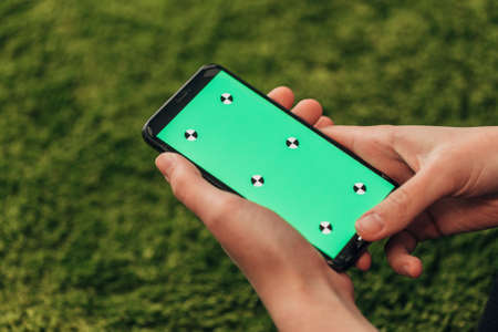 Girl Holds An New Smart Phone In Her Hand