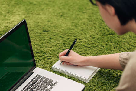 Close-Up Shot of Human Hands Placed Over Laptopの写真素材