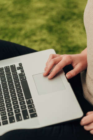 Close-Up Shot of Human Hands Placed Over Laptop
