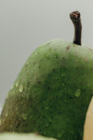 Pear Close Up With Water Droplets on the Peelの写真素材
