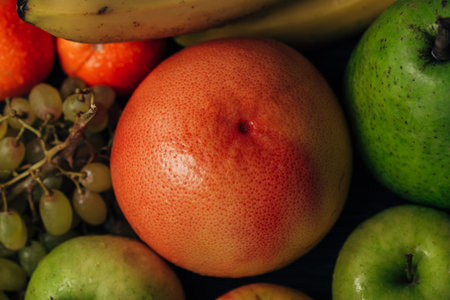 Composition with Summer Colorful Fresh Fruits on Wooden Brown Background