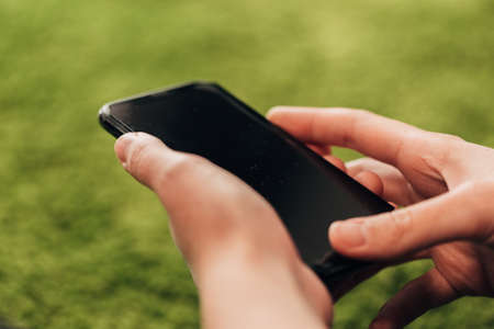 Girl Holds An New Smart Phone In Her Handの写真素材