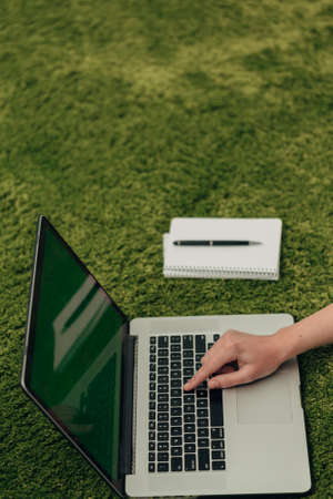 Close-Up Shot of Human Hands Placed Over Laptopの写真素材