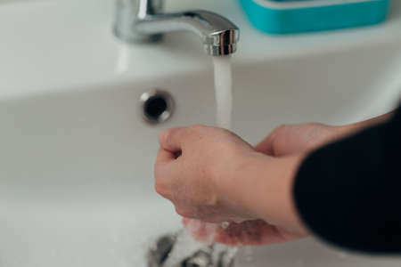 The Girl Washes Her Handsの写真素材