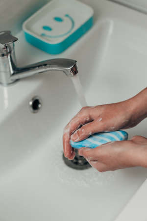 The Girl Washes Her Handsの写真素材