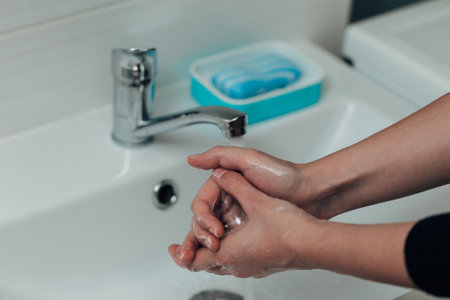The Girl Washes Her Handsの写真素材