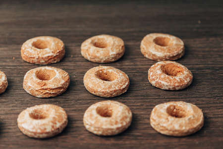 Beautiful Bagels and Gingerbreads Lie on a Brown Background