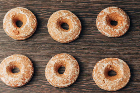 Beautiful Bagels and Gingerbreads Lie on a Brown Backgroundの写真素材