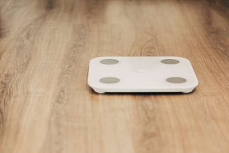 Measures Weight on Smart Scales. Modern Electronic Device.の写真素材