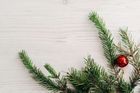 Christmas Composition on a White Wooden Table with Copy Space