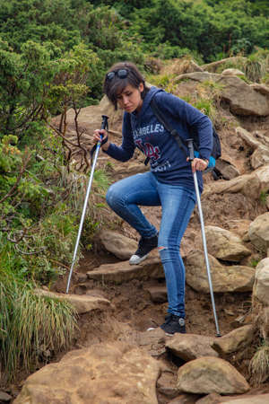 Girl Descend Down a Large Green Mountain Range