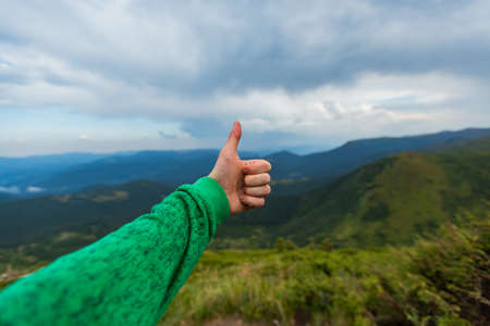 Man Descend Down a Large Green Mountain Rangeの写真素材