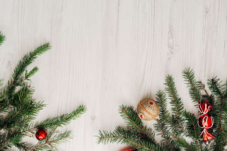 Christmas Composition on a White Wooden Table with Copy Space