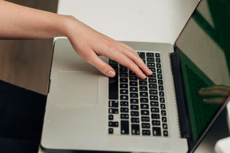Close-Up Shot of Human Hands Placed Over Laptopの写真素材